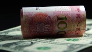 人民币对美元汇率中间价跌破7.1 下调530个基点